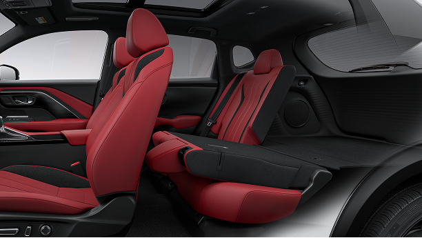 Interior close-up featuring front and back seats demonstrating cargo space. 