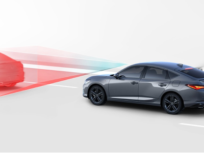 Digital rendering, where everything is white except for the Integra. 3/4 side rear view of grey Integra driving on road. Blue and red sensor lines emitting from the front of the Integra detect the car in front.