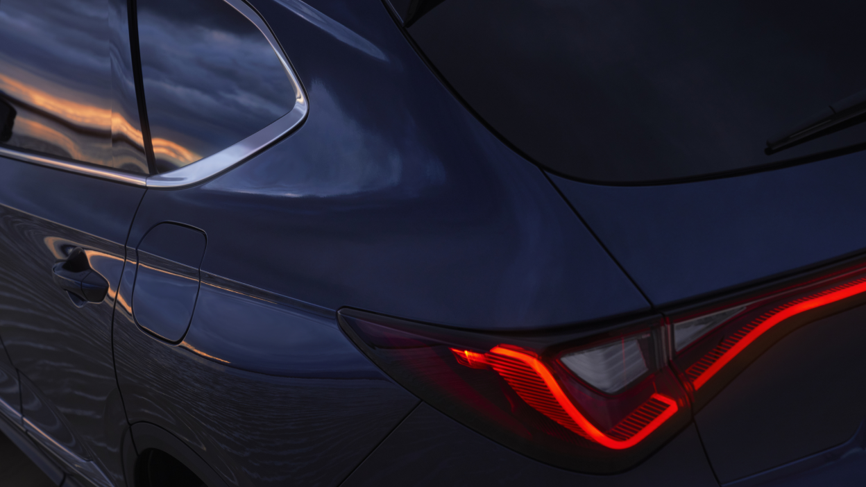 The tail light of a red MDX.