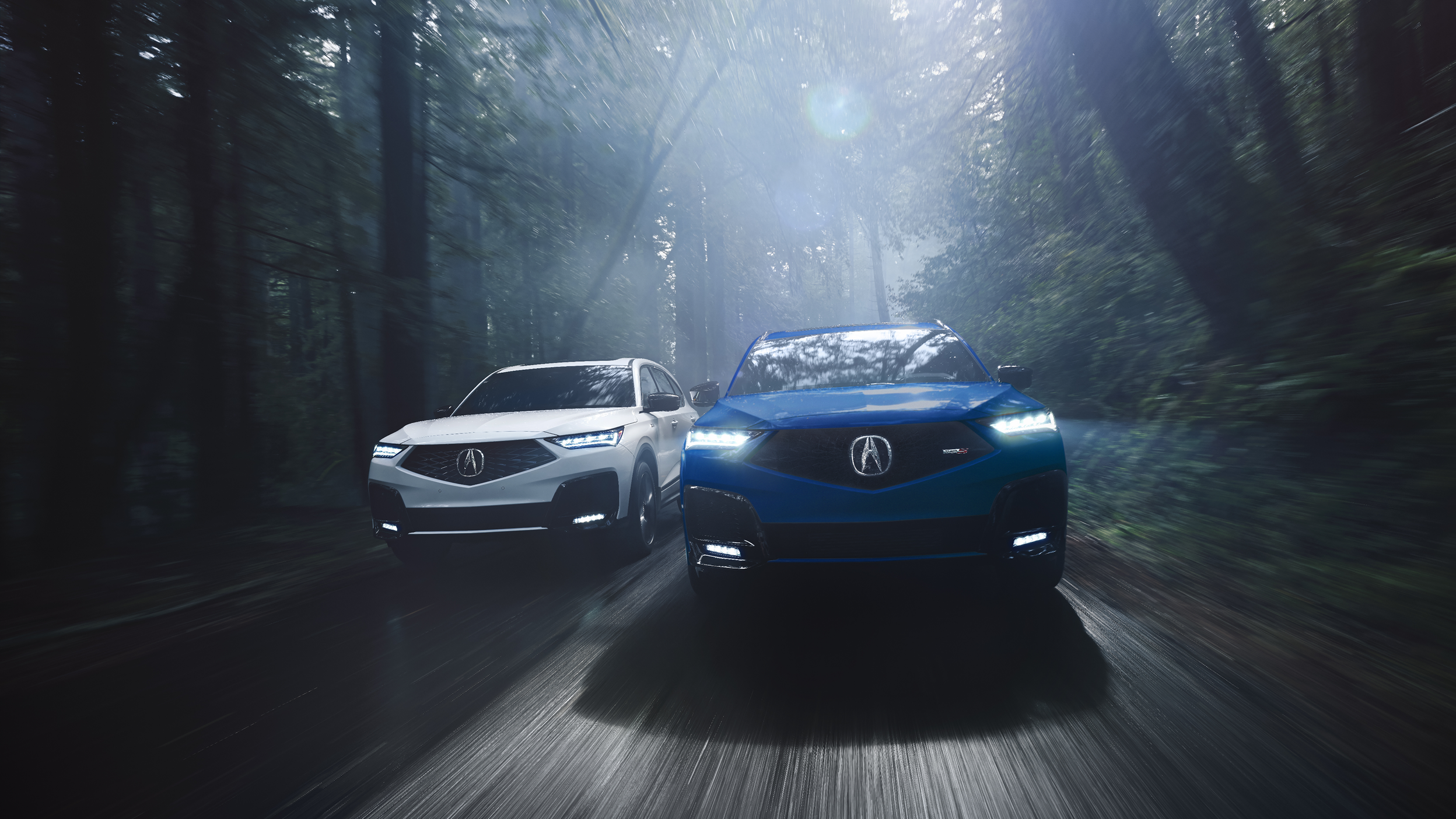 A red MDX parked inside a bright, spacious warehouse.