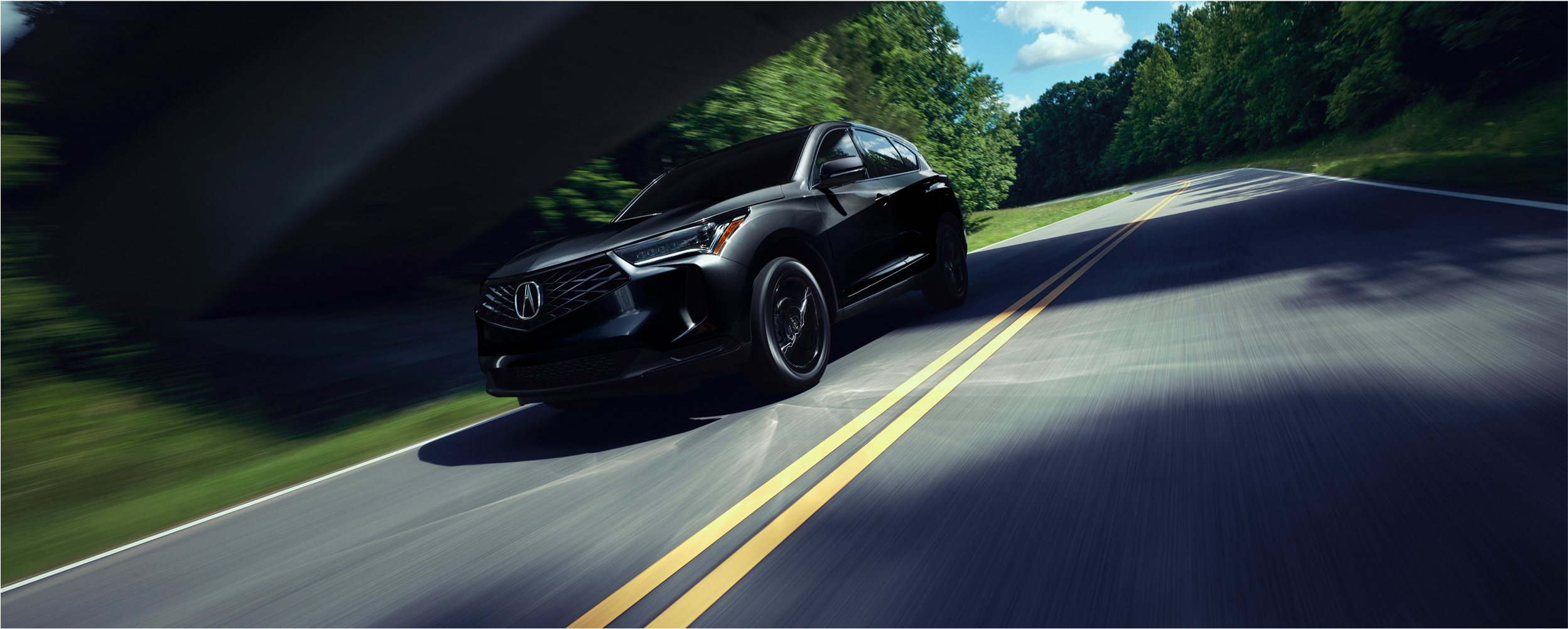 3/4 front view of RDX grille and Acura emblem.