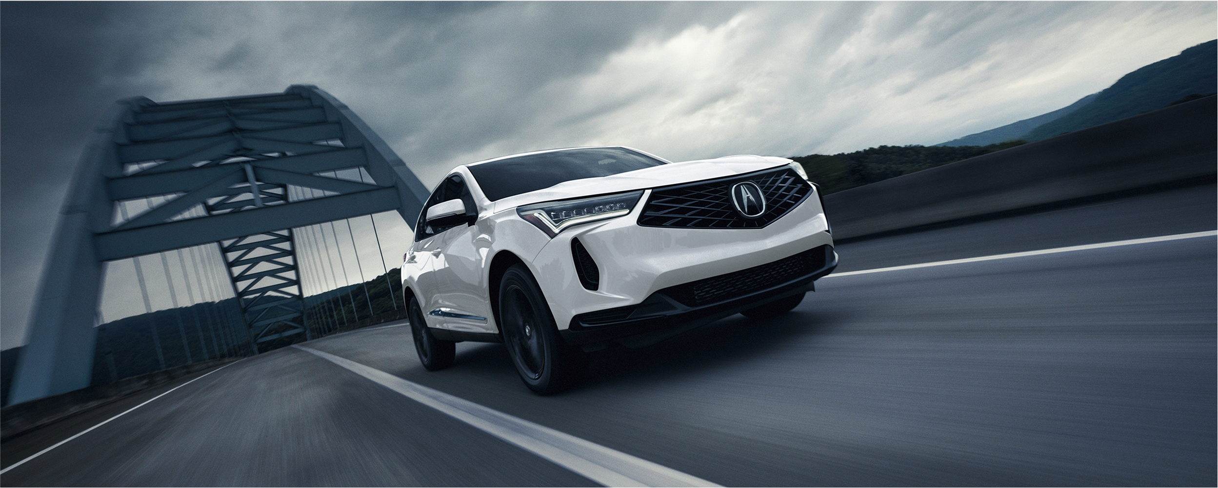 Full profile view of grey RDX in a warehouse with red backlighting.