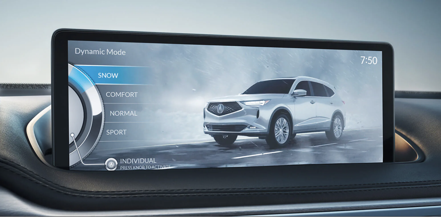 Close-up of the navigation screen in an Acura MDX displaying the different drive modes available to the driver. The mode “SNOW” is selected and highlighted blue. Gros plan de l’écran de navigation d’un Acura MDX affichant les différents modes de conduite offerts au conducteur. Le mode « SNOW » est sélectionné et mis en évidence en bleu.